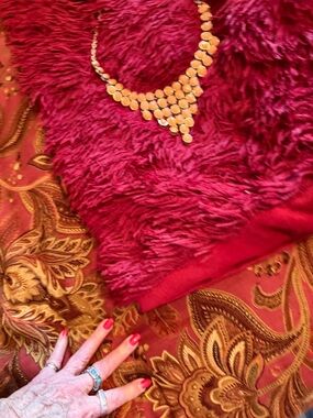 Plush Deep Red Faux Fur Accent Pillow with Gold Necklace Styling